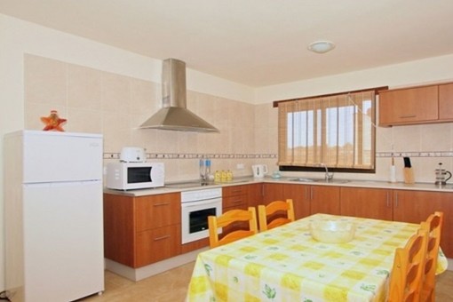 Bright kitchen with dining area