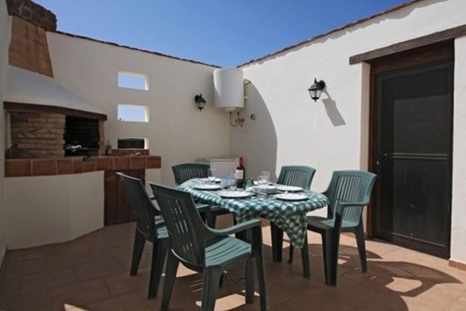 Sunny terrace with dining area