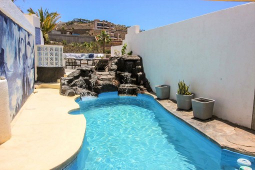 Private pool with small waterfall
